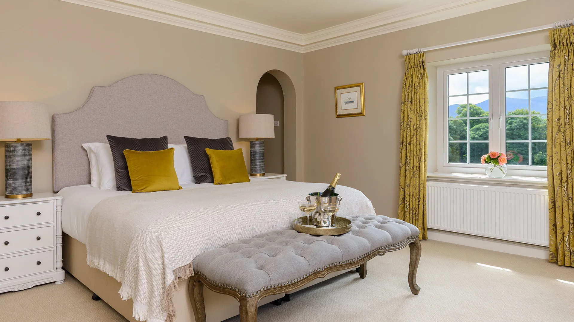 A bedroom at Kenmare House with period furnishings